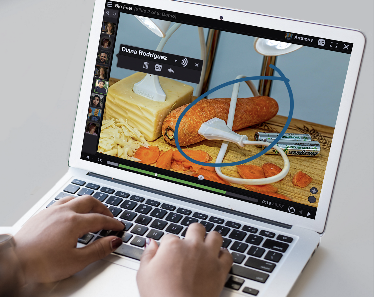 A laptop displays an image of a science experiment. Part of the experiment has been circled to demonstrate VoiceThread's on-screen capabilities.